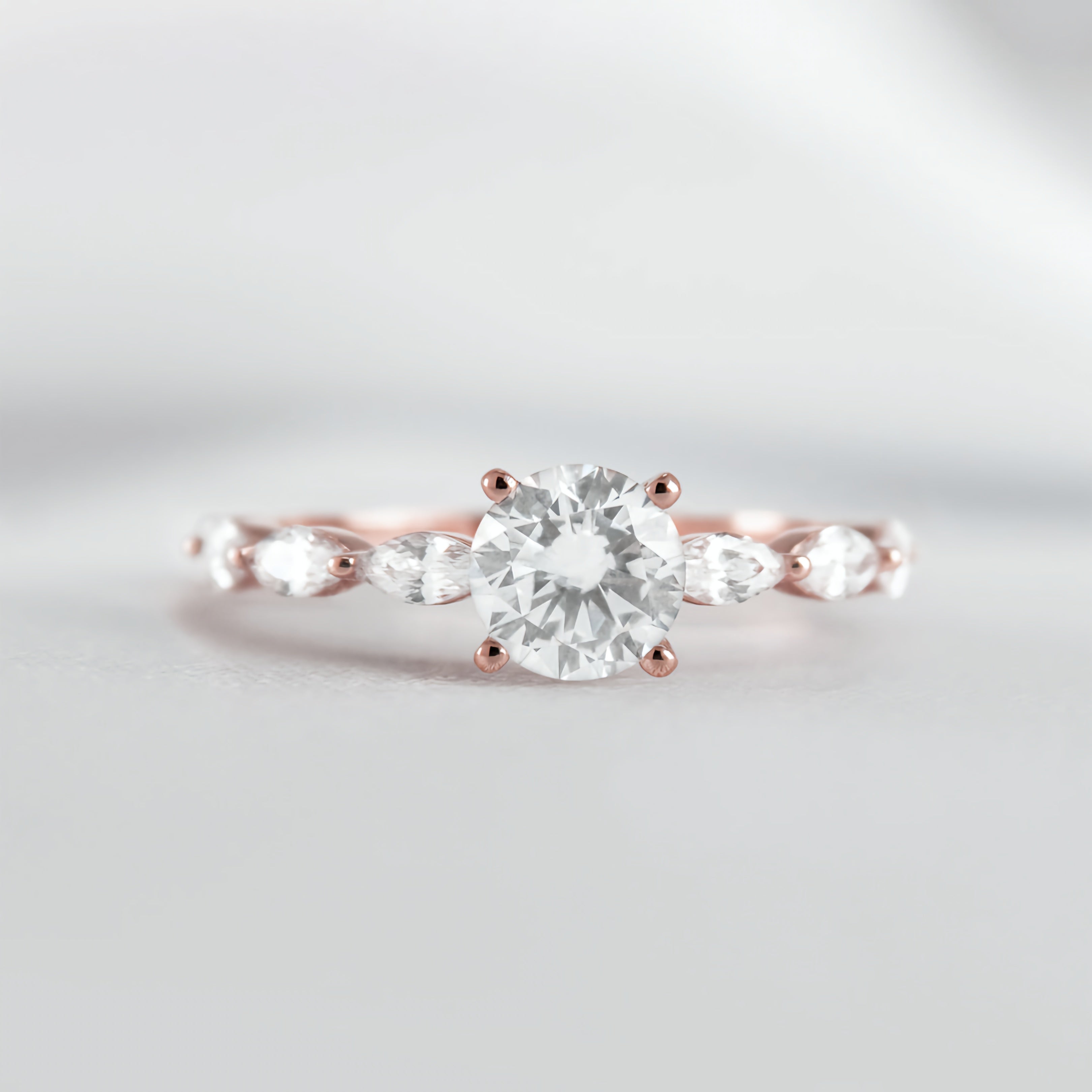 Round Solitaire Ring with Marquise Band