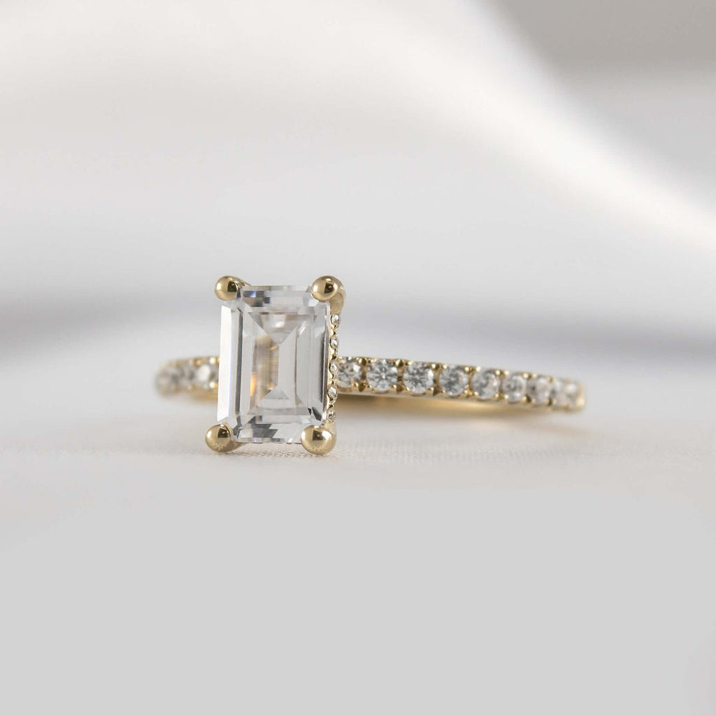 Emerald Cut Hidden Halo Ring with Pave Band