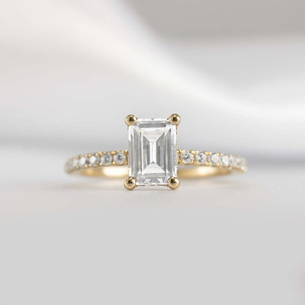 Emerald Cut Hidden Halo Ring with Pave Band